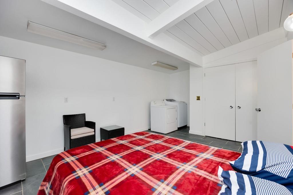 255 Montezuma Road Borrego Springs, CA 92004 - Photo 21 of 26 a bedroom with a bed and a lamp