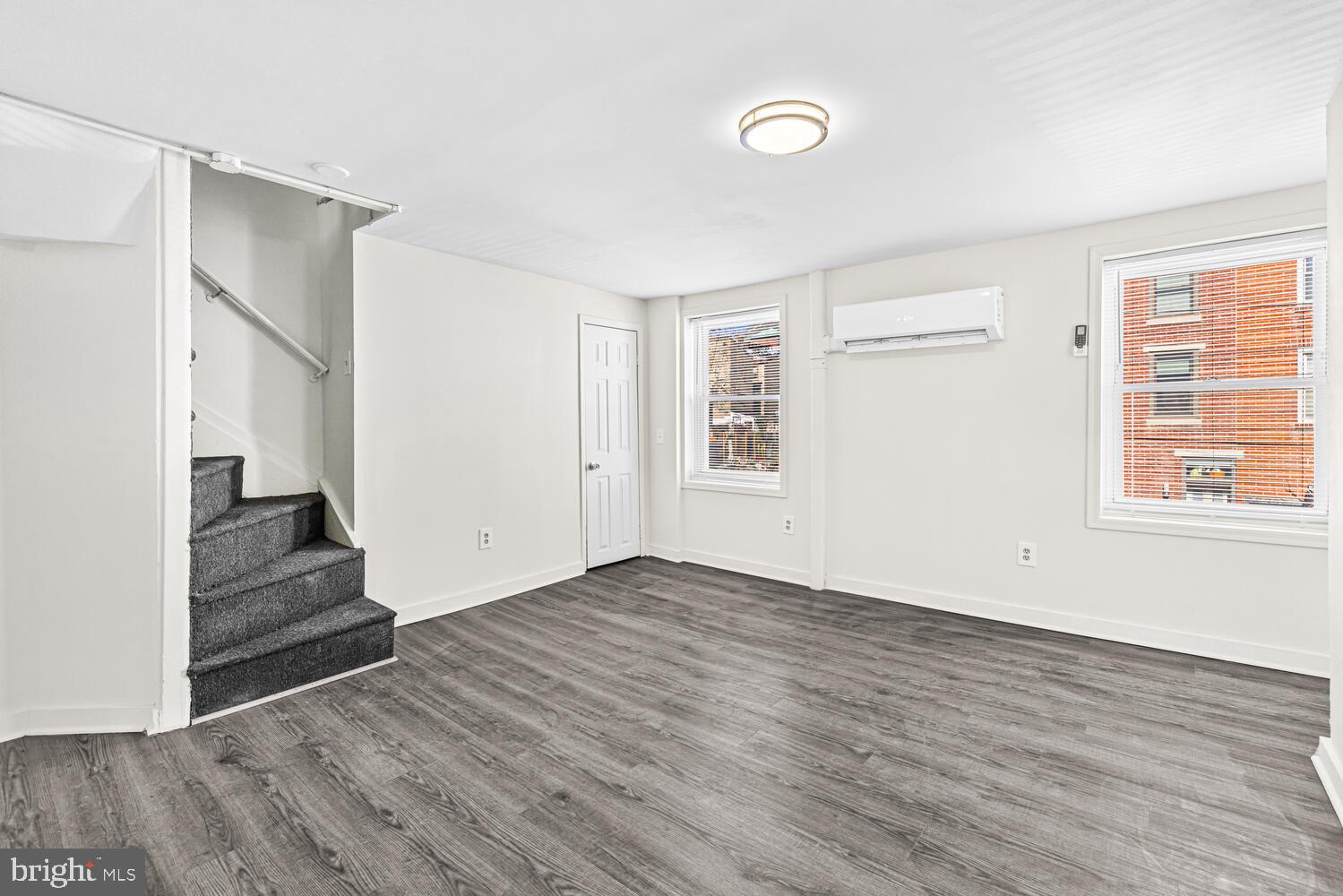 178 Master Street Philadelphia, PA 19122 - Photo 12 of 19 an empty room with wooden floor and windows
