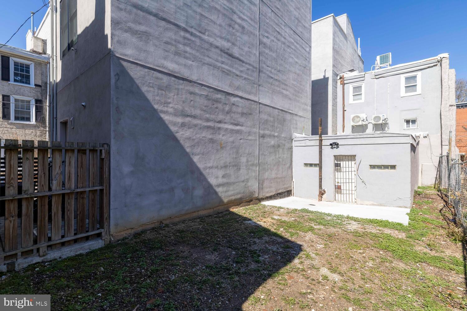 178 Master Street Philadelphia, PA 19122 - Photo 18 of 19 a view of a house with a sink and wooden fence