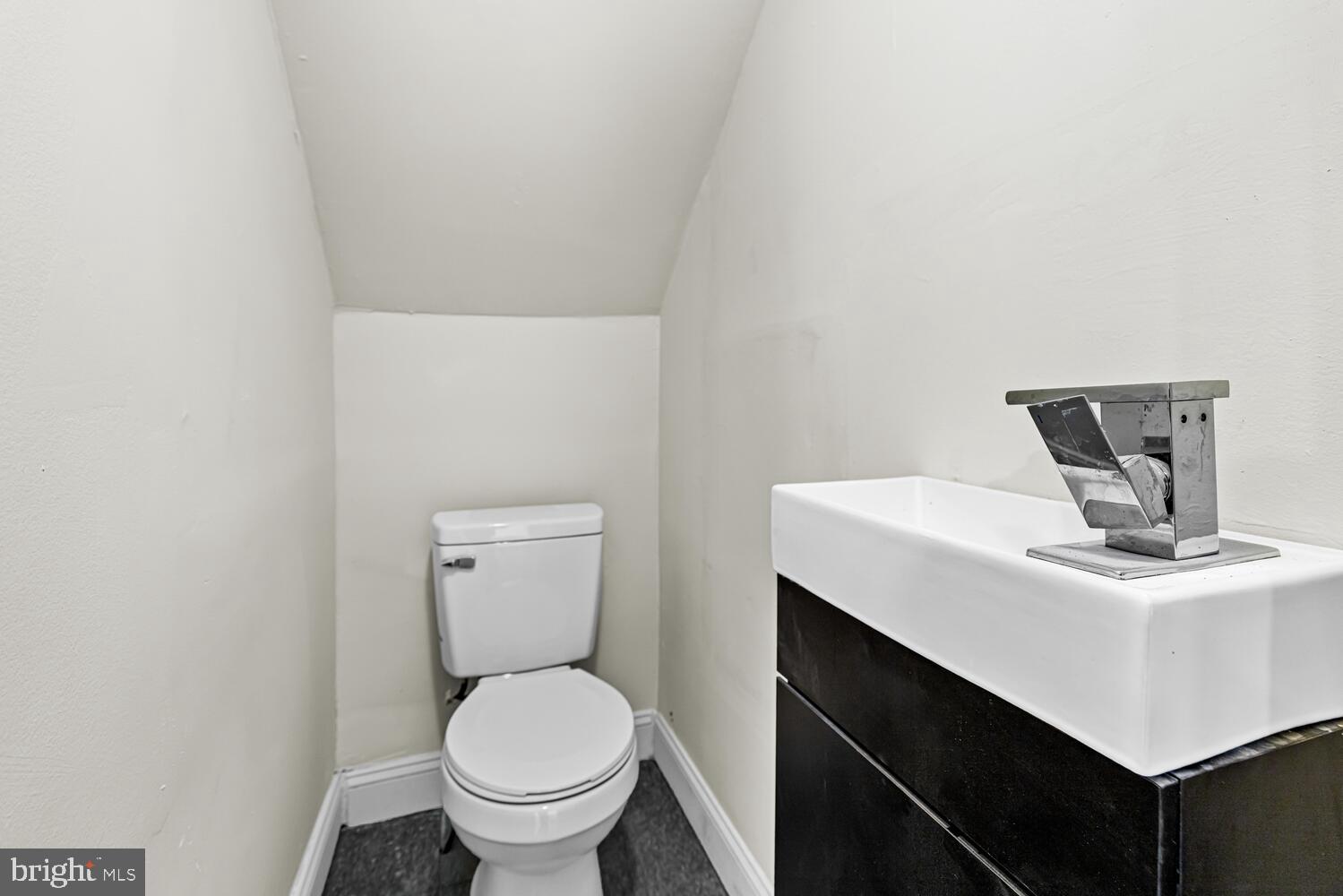 178 Master Street Philadelphia, PA 19122 - Photo 4 of 19 a bathroom with a toilet a sink and mirror