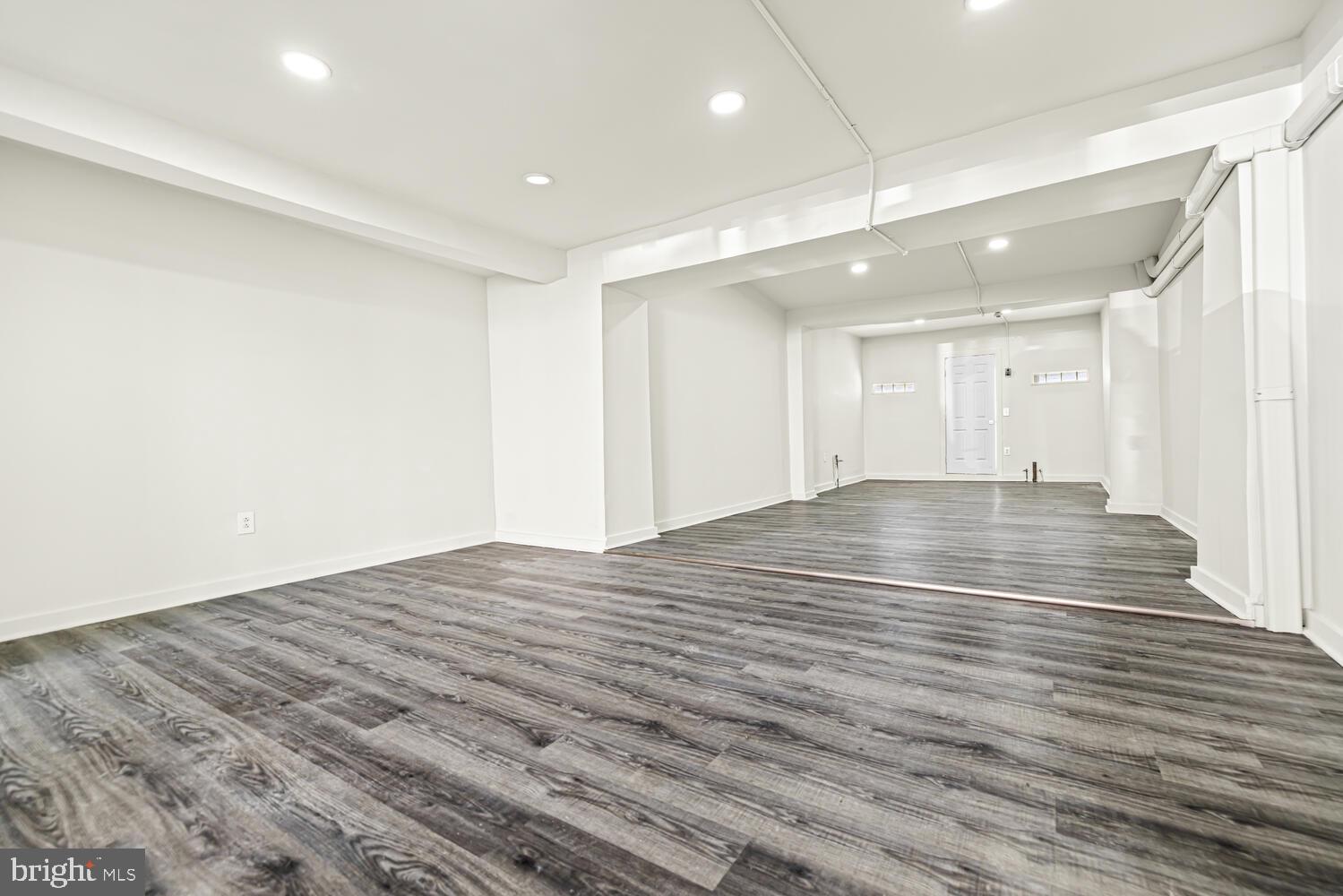 178 Master Street Philadelphia, PA 19122 - Photo 5 of 19 a view of an empty room with wooden floor and entryway