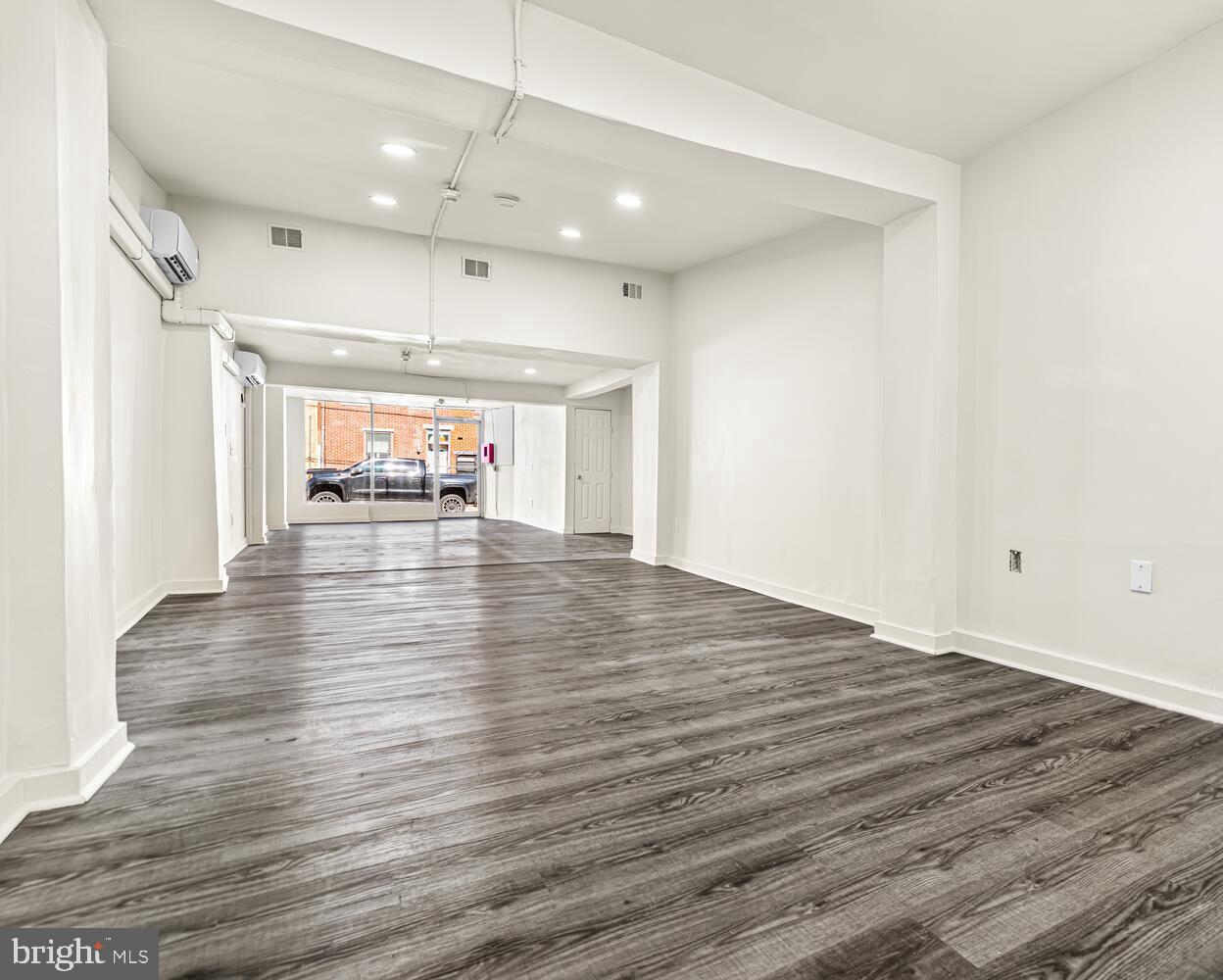 178 Master Street Philadelphia, PA 19122 - Photo 6 of 19 an empty room with wooden floor and windows