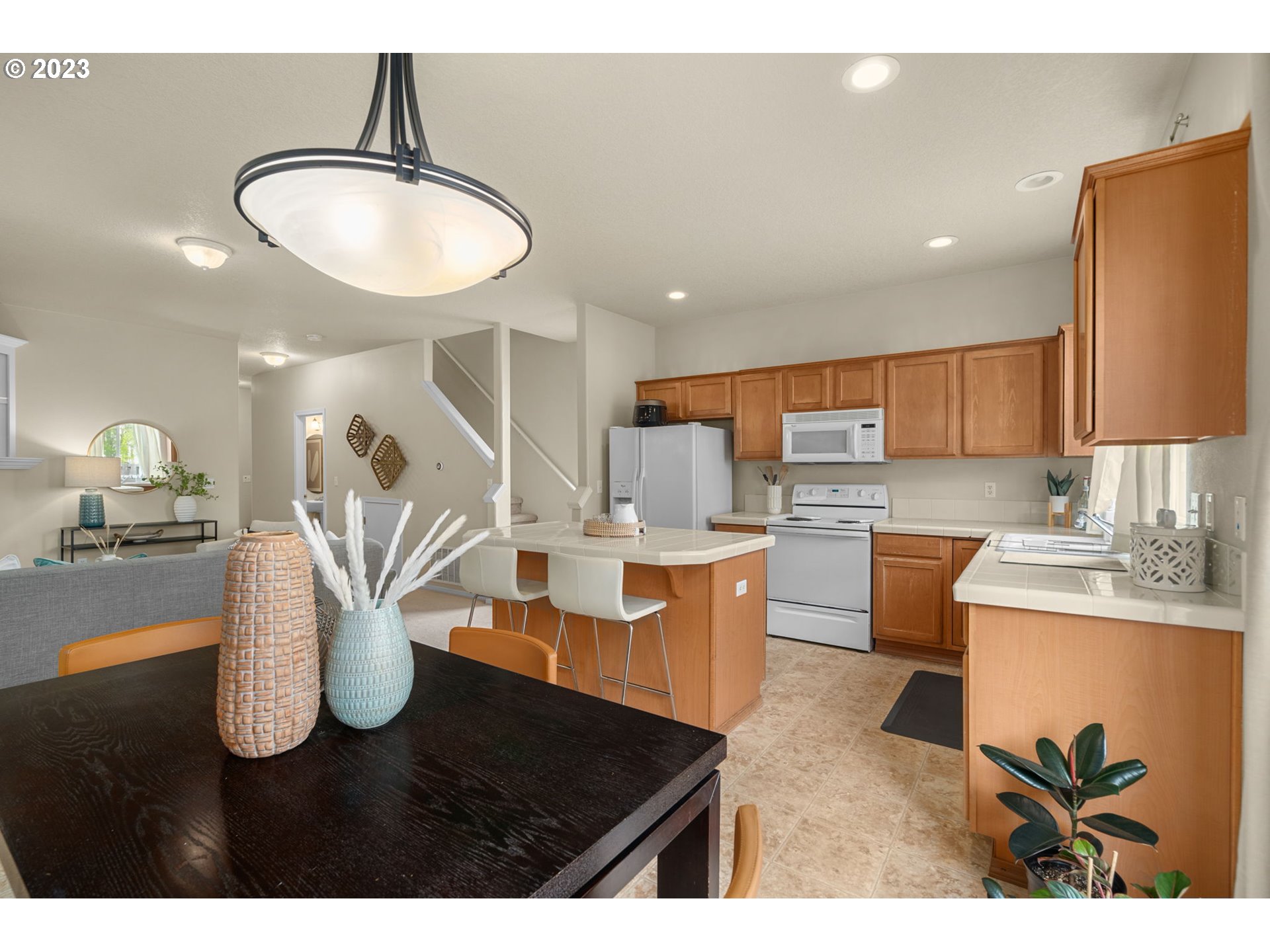 17697 Southwest September Lane Beaverton, OR 97003 - Photo 12 of 24 a kitchen with cabinets and refrigerator