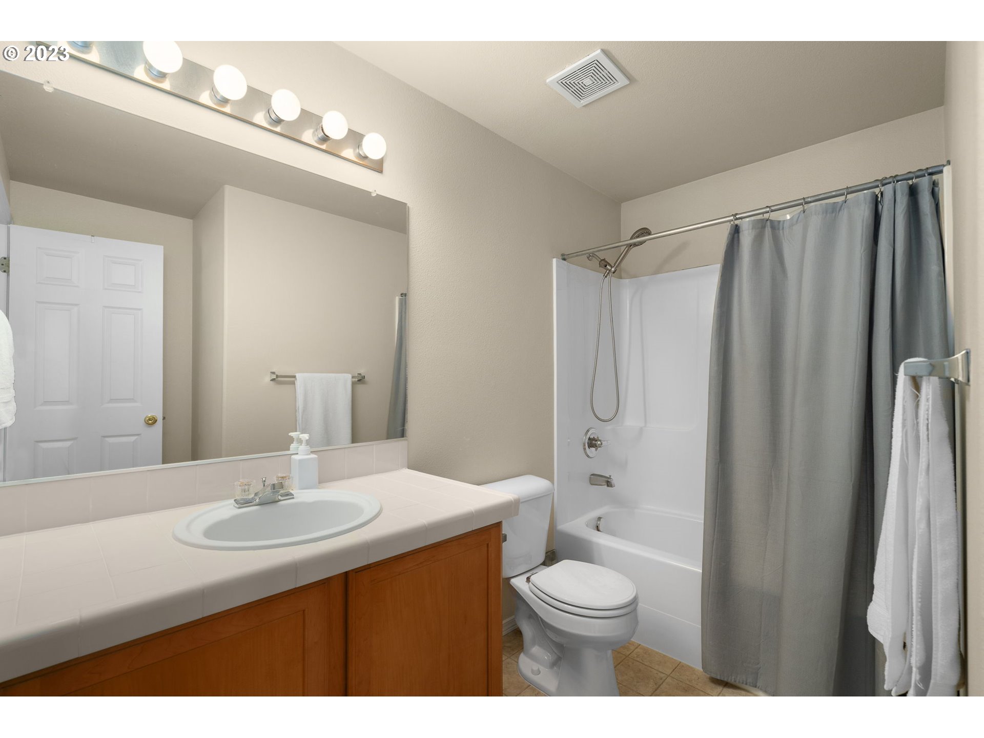 17697 Southwest September Lane Beaverton, OR 97003 - Photo 19 of 24 a bathroom with a sink a toilet and shower