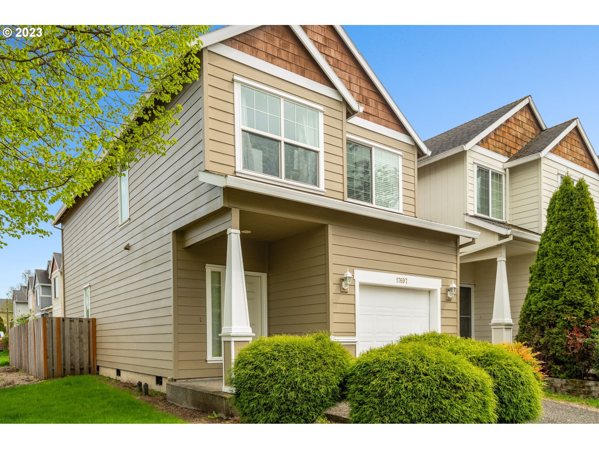 17697 Southwest September Lane Beaverton, OR 97003 - Photo 2 of 24 a front view of a house with a yard