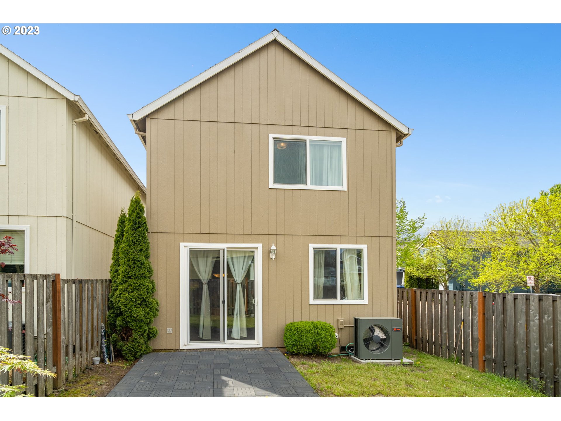 17697 Southwest September Lane Beaverton, OR 97003 - Photo 23 of 24 a view of a house with wooden fence and plants
