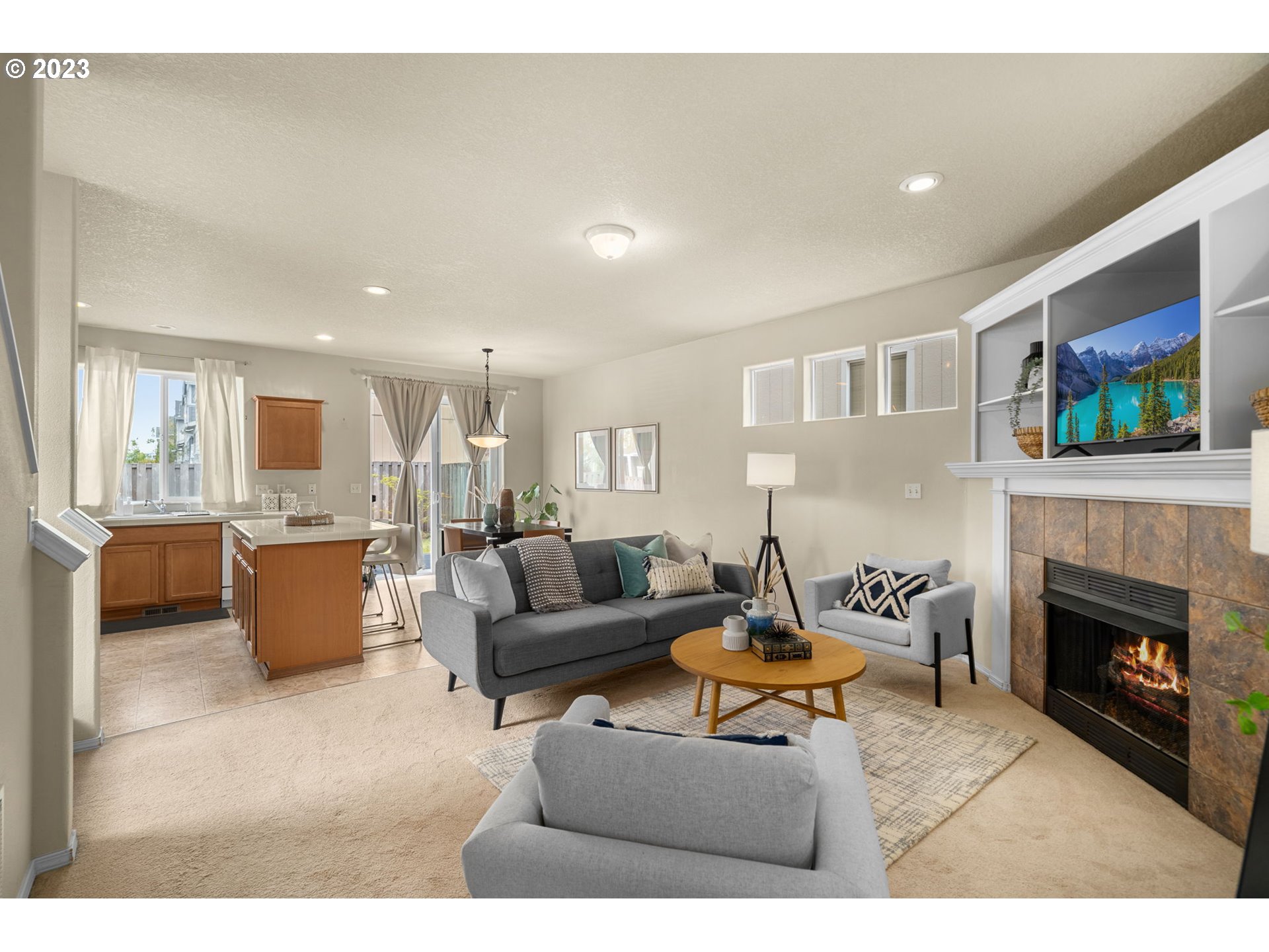 17697 Southwest September Lane Beaverton, OR 97003 - Photo 4 of 24 a living room with furniture and a fireplace