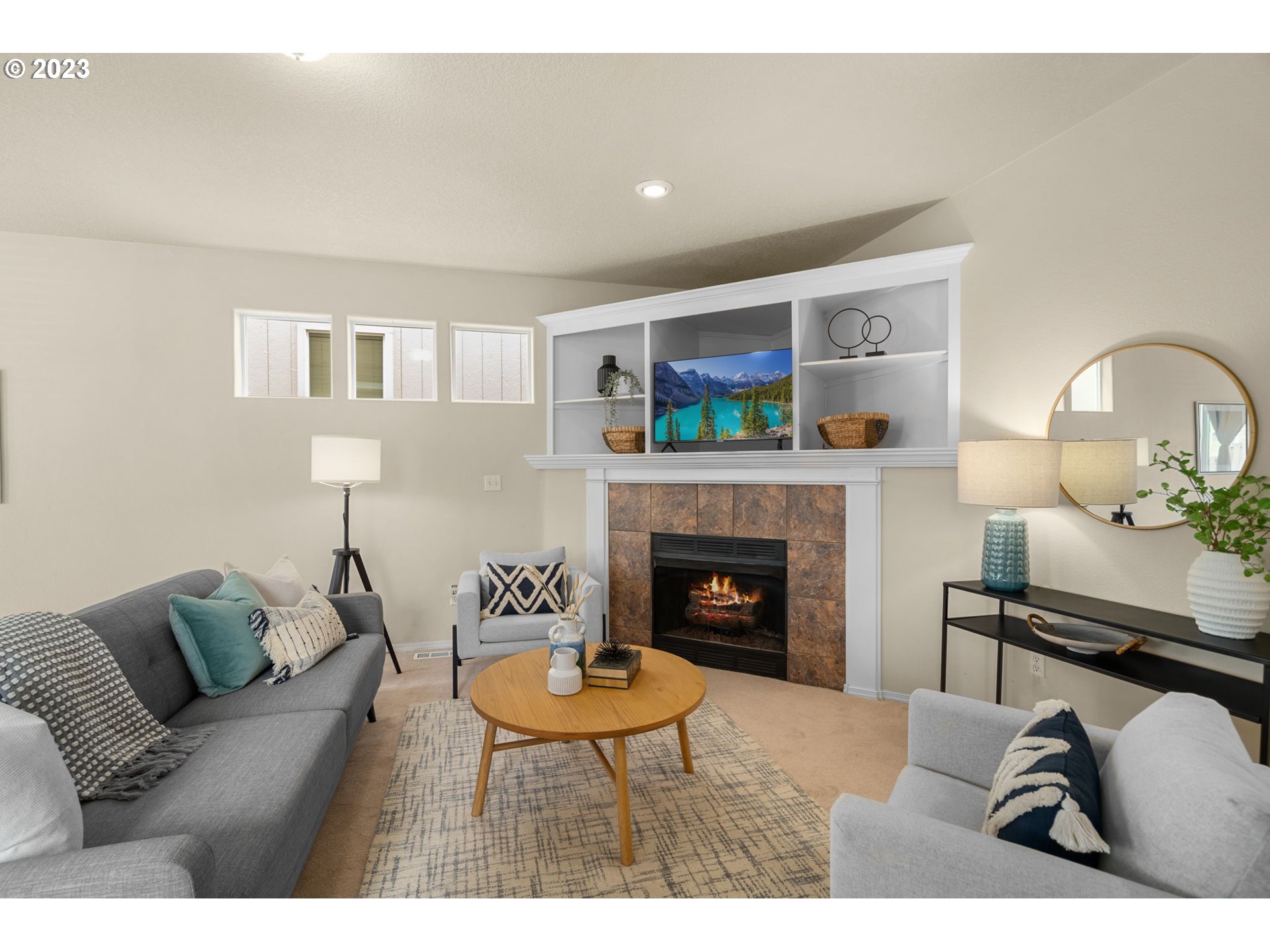 17697 Southwest September Lane Beaverton, OR 97003 - Photo 5 of 24 a living room with furniture and a fireplace