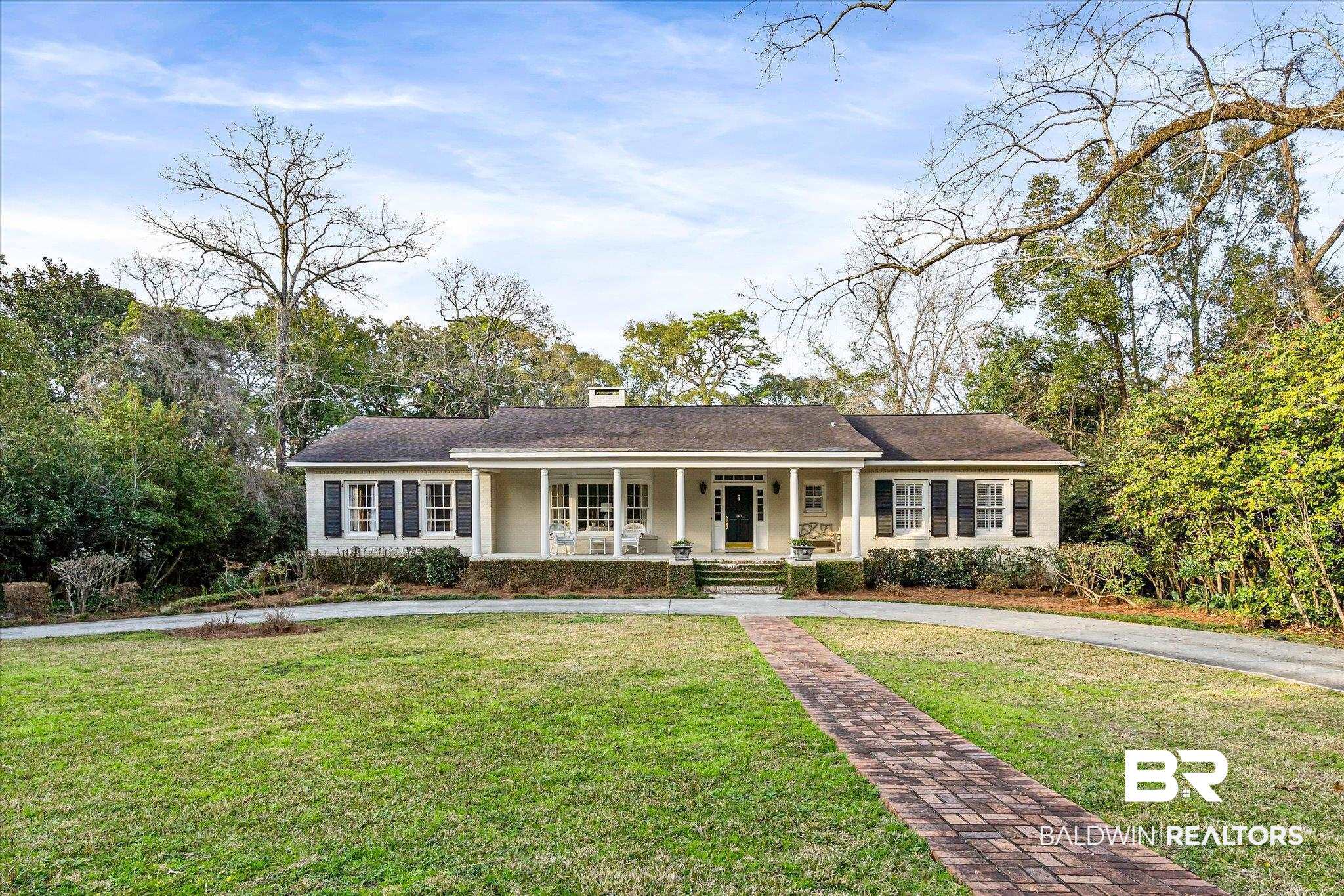 143 Myrtlewood Lane Mobile, AL 36608 - Photo 1 of 55 View of front of property featuring a porch, a chimney, and a front yard