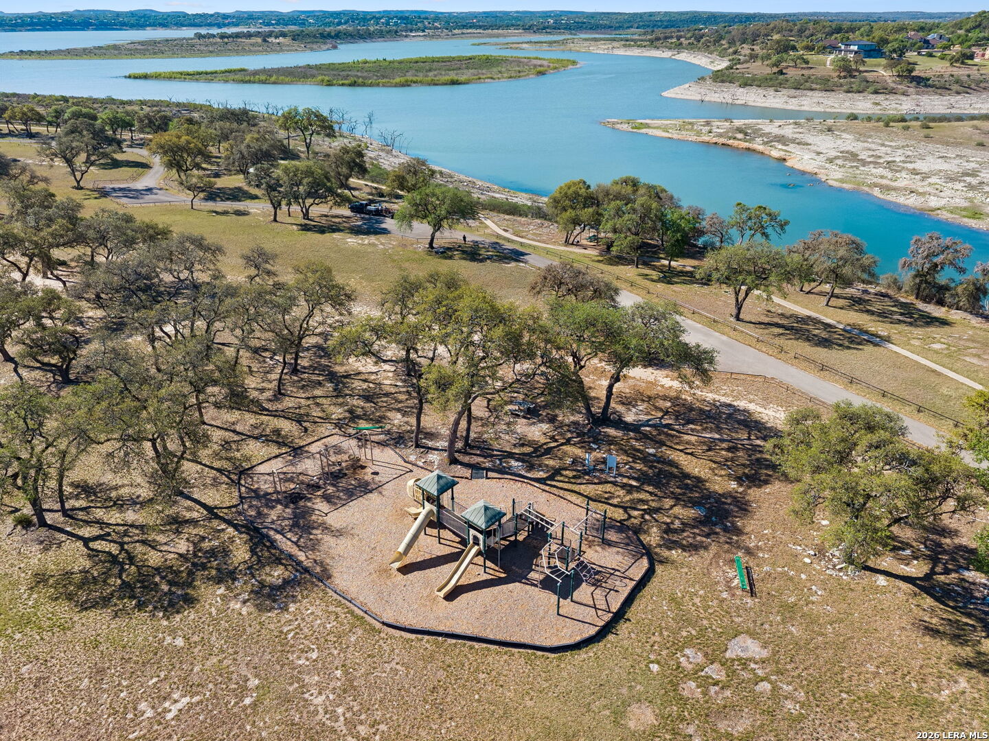 238 Charon Spring Branch, TX 78070 - Photo 29 of 30 a view of a lake with a beach