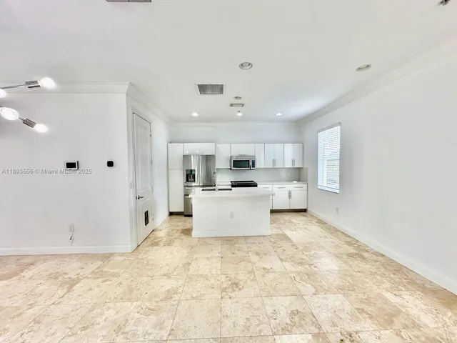 a bathroom with a sink mirror toilet and bathtub