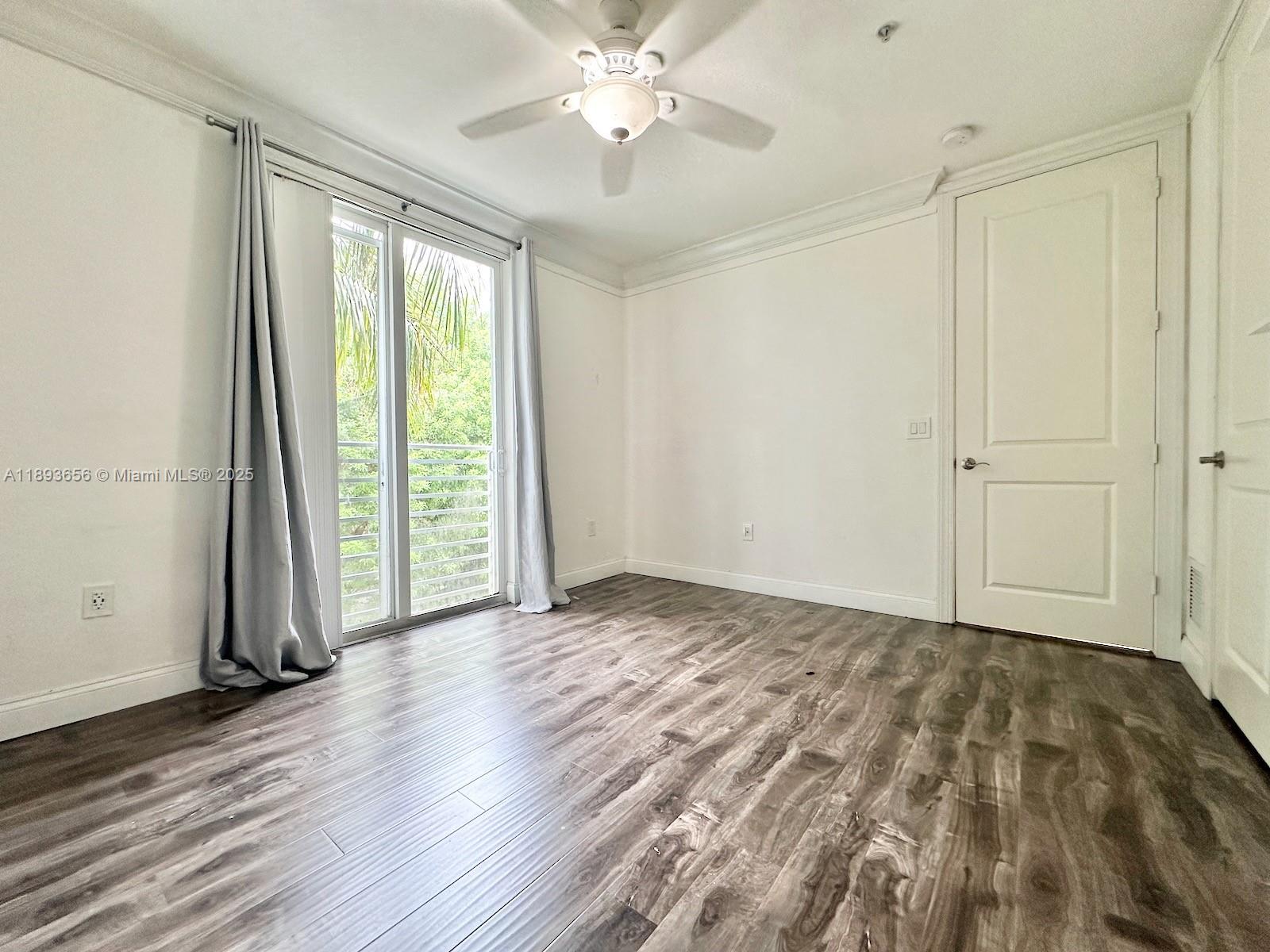 813 Southeast 18th Court Fort Lauderdale, FL 33316 - Photo 23 of 43 a view of an empty room with a window and wooden floor