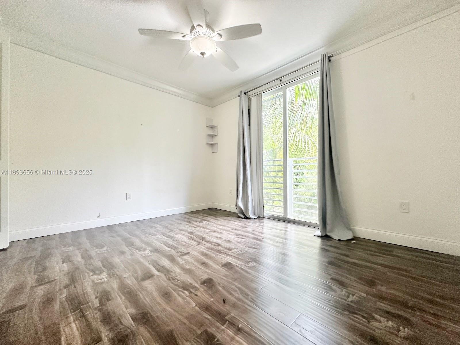 813 Southeast 18th Court Fort Lauderdale, FL 33316 - Photo 25 of 43 an empty room with wooden floor and windows