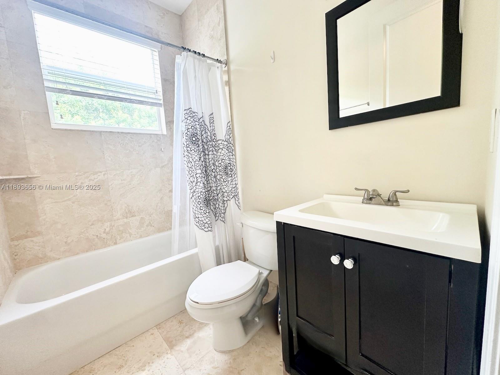 813 Southeast 18th Court Fort Lauderdale, FL 33316 - Photo 27 of 43 a bathroom with a sink mirror toilet and bathtub