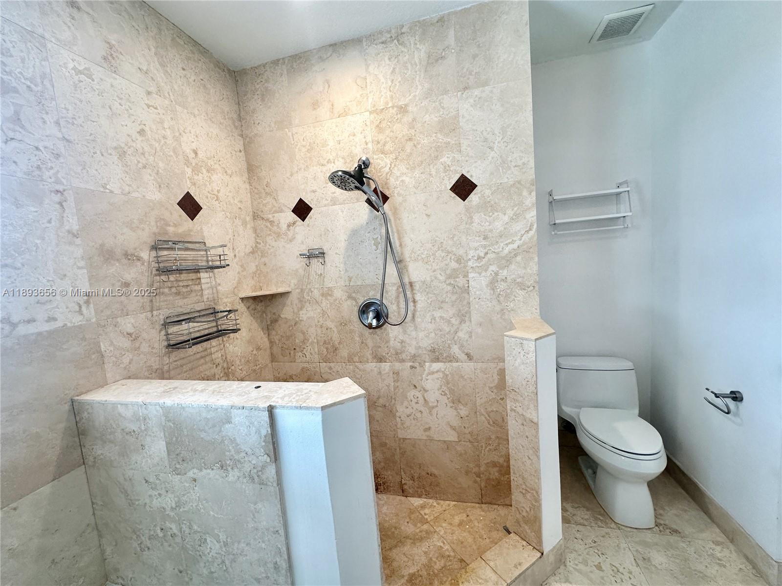813 Southeast 18th Court Fort Lauderdale, FL 33316 - Photo 29 of 43 a bathroom with a granite countertop shower and a toilet
