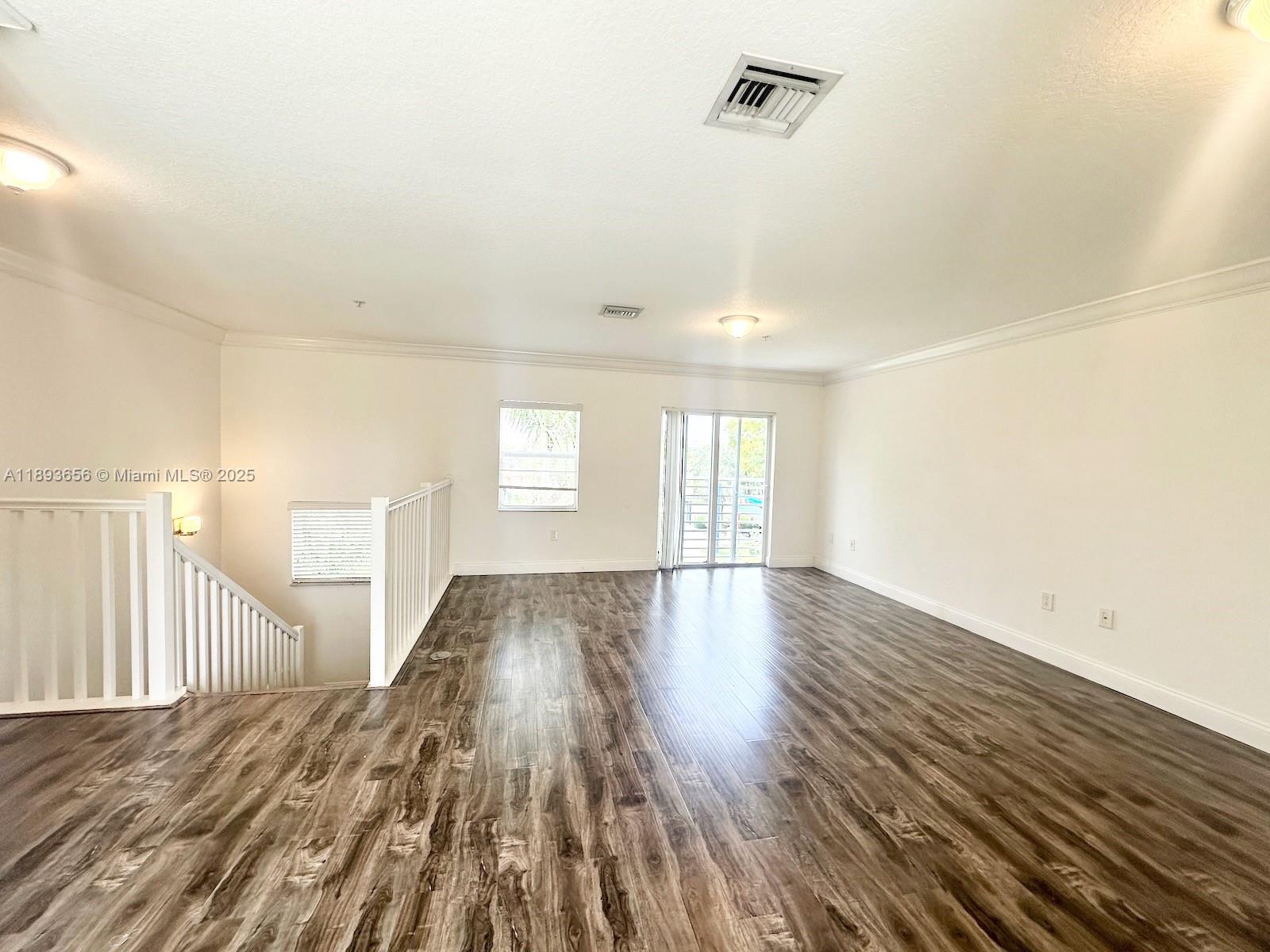 813 Southeast 18th Court Fort Lauderdale, FL 33316 - Photo 36 of 43 a view of empty room with wooden floor and fan