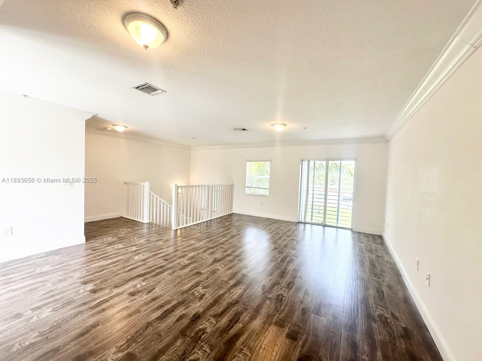 813 Southeast 18th Court Fort Lauderdale, FL 33316 - Photo 37 of 43 a view of an empty room with wooden floor and a window