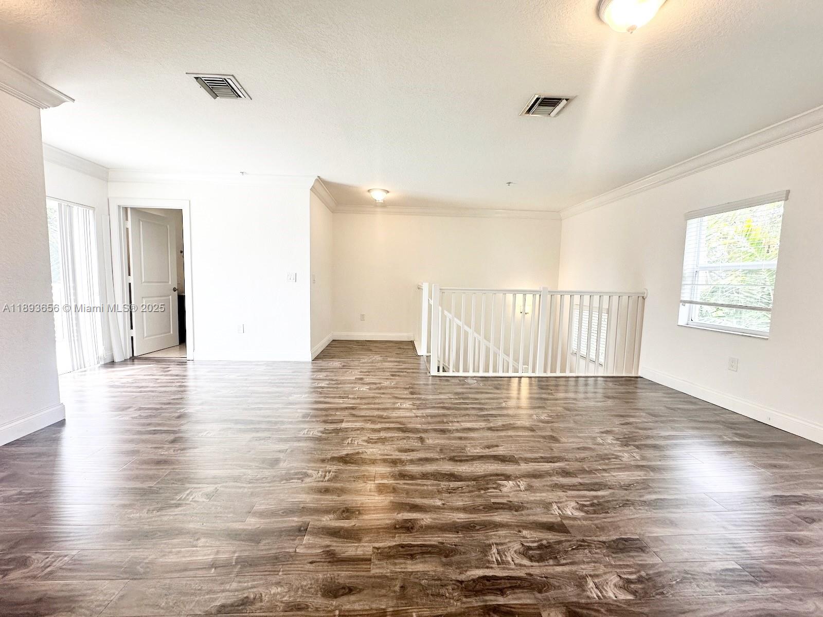 813 Southeast 18th Court Fort Lauderdale, FL 33316 - Photo 38 of 43 a view of an empty room with wooden floor and a window
