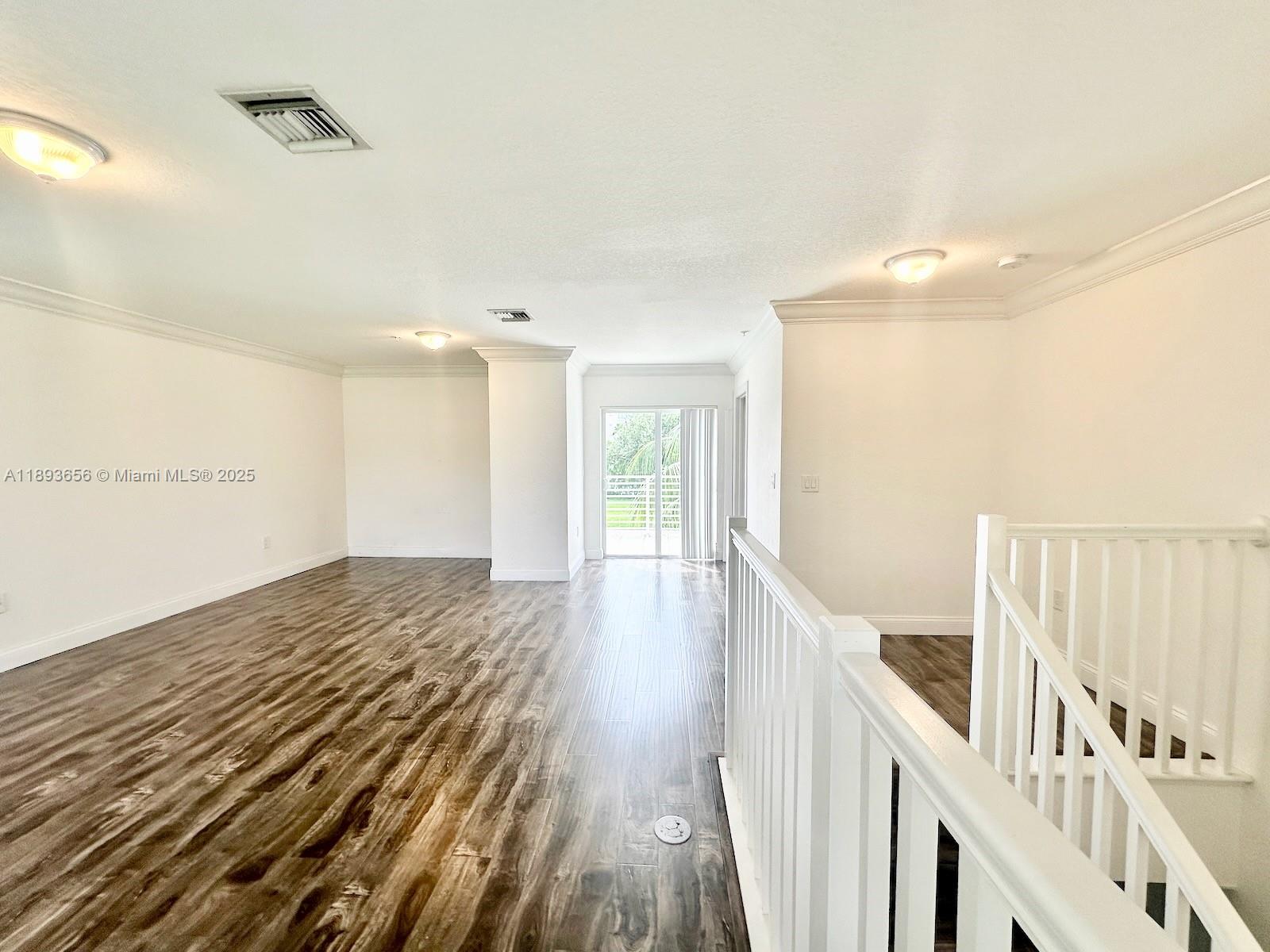 813 Southeast 18th Court Fort Lauderdale, FL 33316 - Photo 40 of 43 a view of an empty room with wooden floor and a window