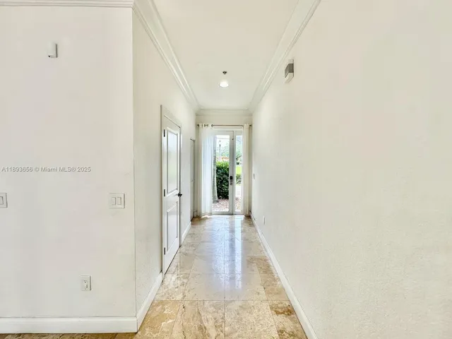 a bathroom with a shower and a glass door