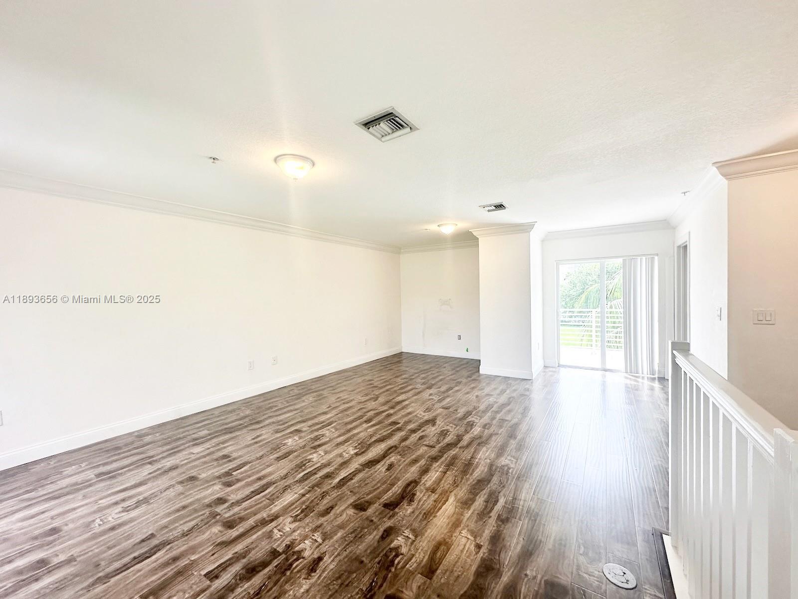 813 Southeast 18th Court Fort Lauderdale, FL 33316 - Photo 41 of 43 a view of a room with wooden floor and ceiling fan