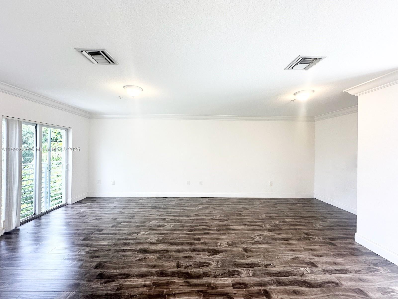 813 Southeast 18th Court Fort Lauderdale, FL 33316 - Photo 42 of 43 a view of a room with wooden floor and white walls