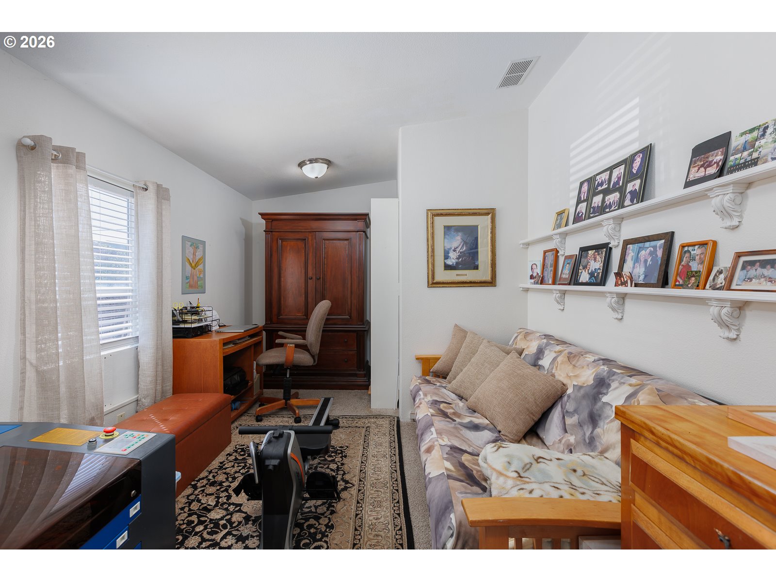 2018 Northwest Oceanic Loop Waldport, OR 97394 - Photo 24 of 35 a living room with furniture and a book shelf