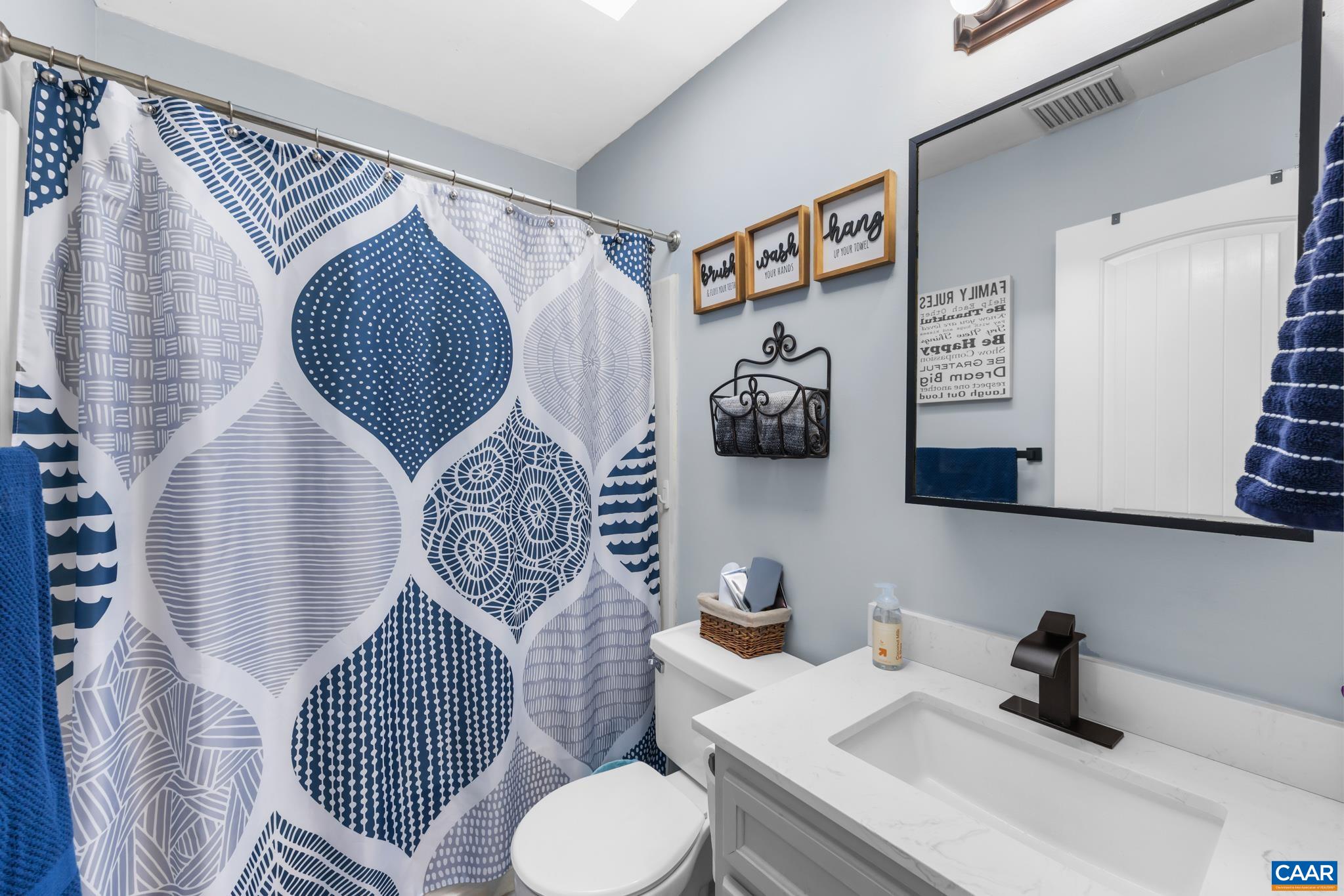 1971 Wilderness Road Reva, VA 22735 - Photo 29 of 47 a bathroom with a sink mirror and toilet