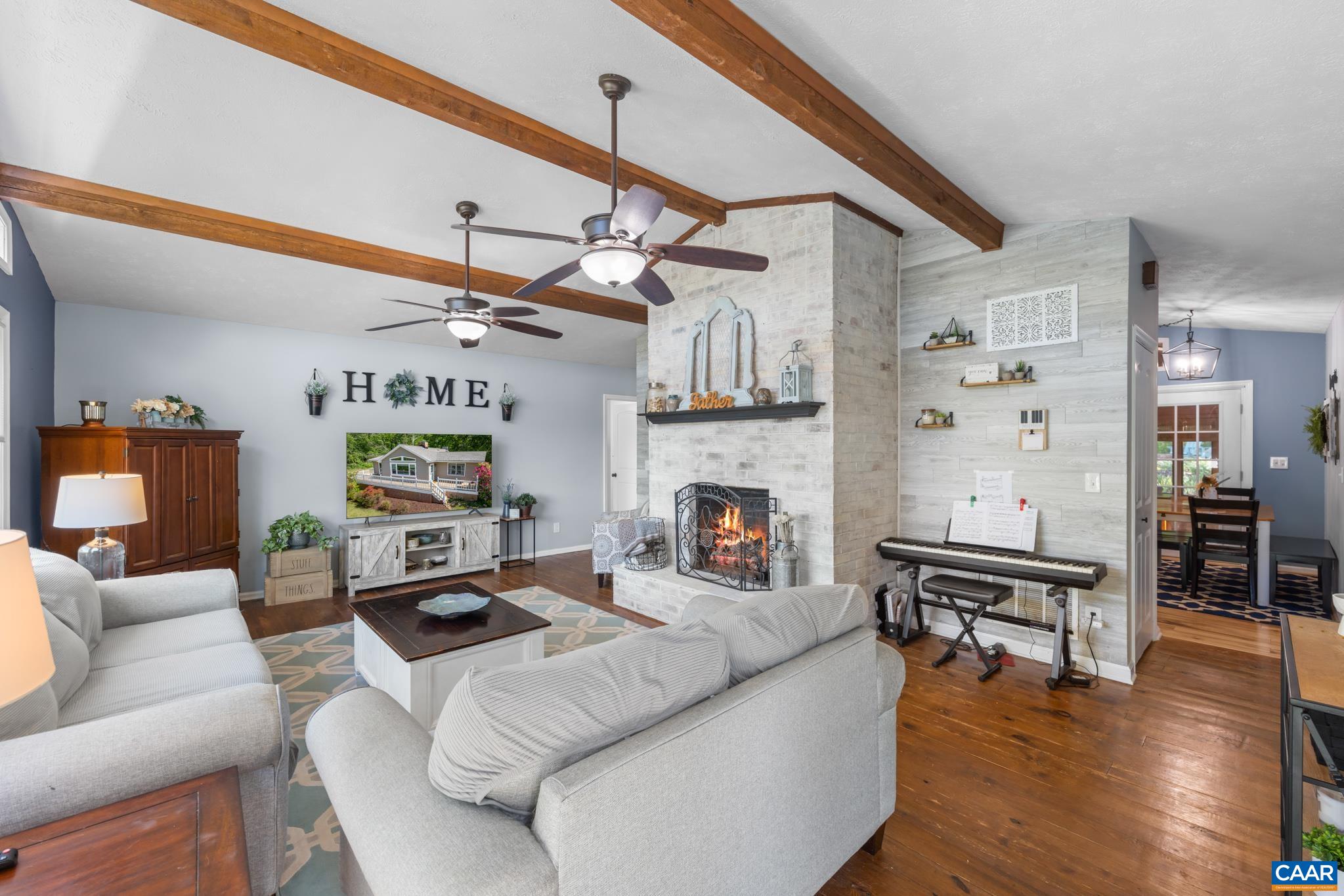 1971 Wilderness Road Reva, VA 22735 - Photo 5 of 47 a living room with furniture wooden floor and a fireplace
