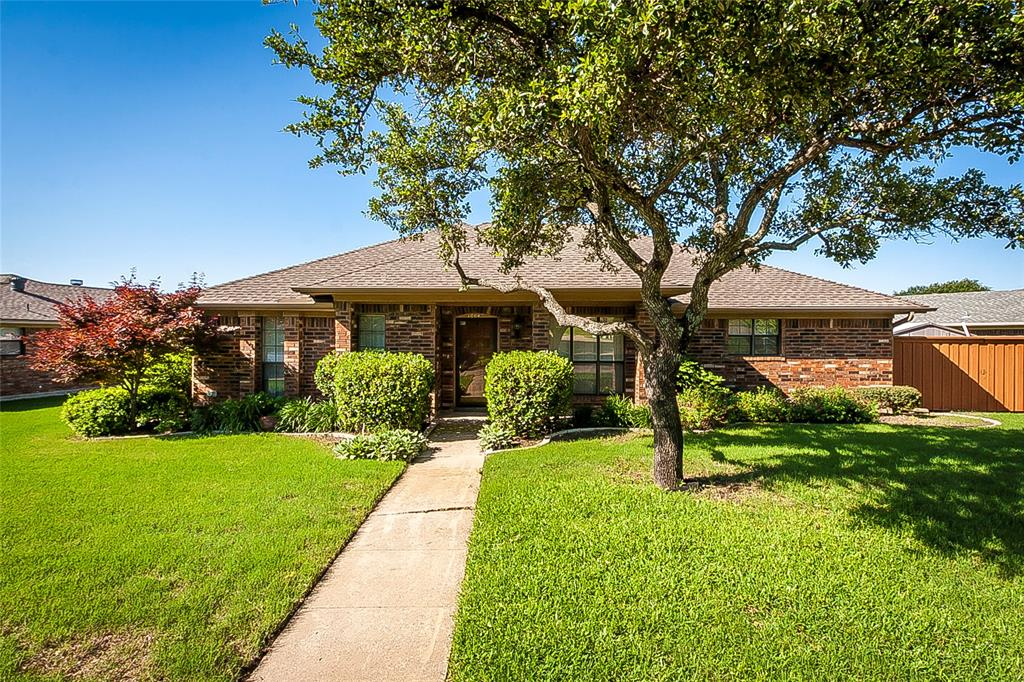 1004 Ledgemont Drive Plano, TX 75025 - Photo 1 of 29 a front view of a house with a yard