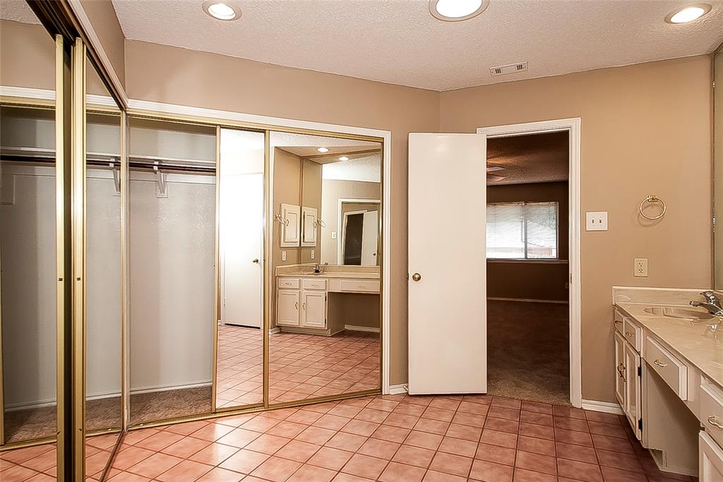1004 Ledgemont Drive Plano, TX 75025 - Photo 20 of 29 a view of a bathroom with sink