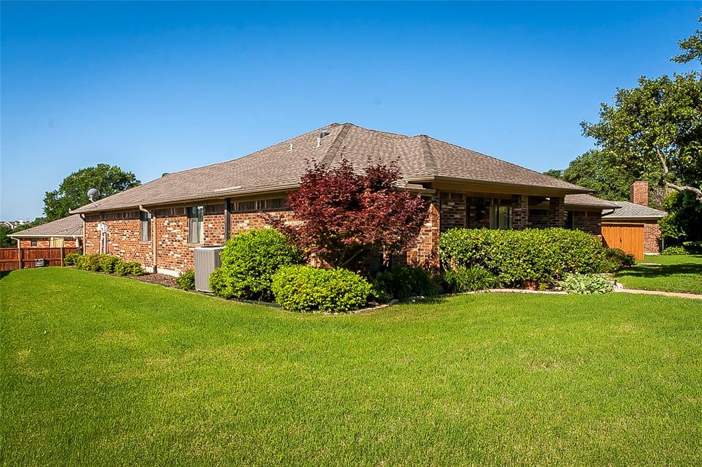 1004 Ledgemont Drive Plano, TX 75025 - Photo 2 of 29 a front view of a house with a yard