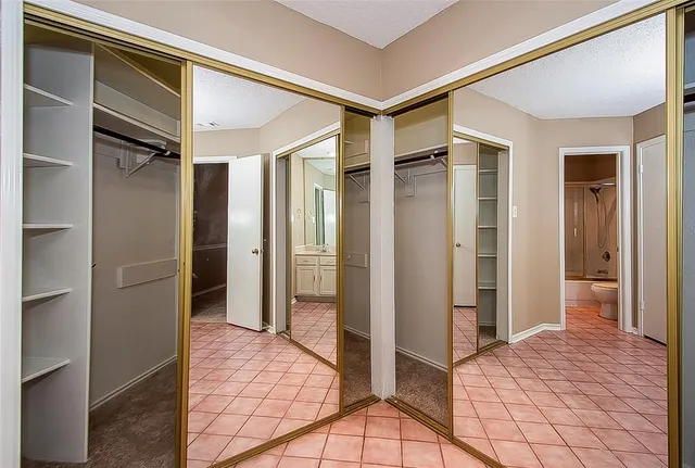 a bathroom with a shower and a sink
