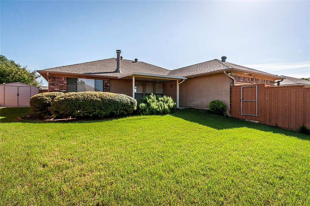 1004 Ledgemont Drive Plano, TX 75025 - Photo 28 of 29 a front view of a house with garden