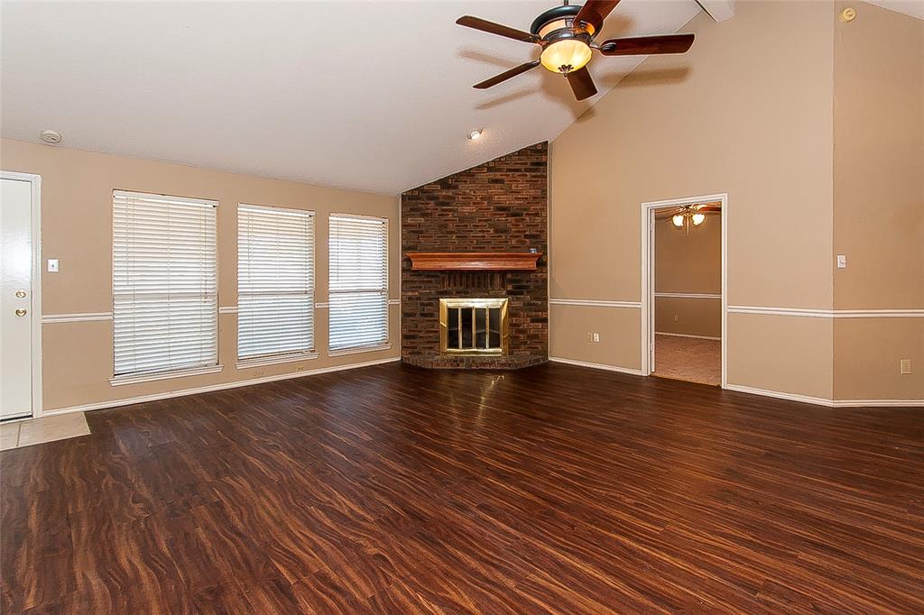 1004 Ledgemont Drive Plano, TX 75025 - Photo 3 of 29 wooden floor in an empty room with a window