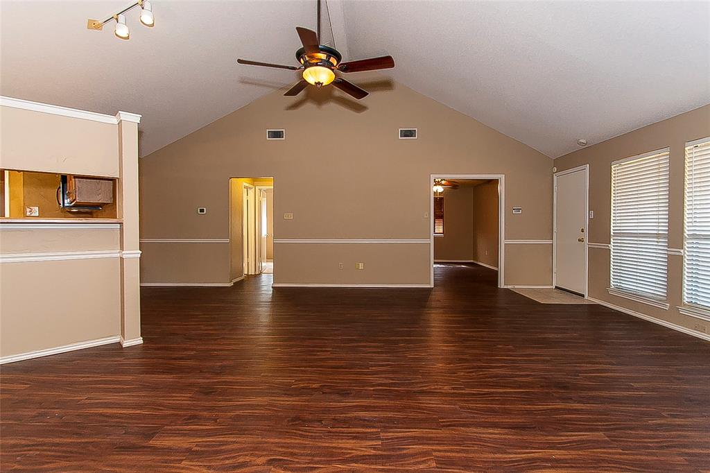 1004 Ledgemont Drive Plano, TX 75025 - Photo 4 of 29 a view of empty room with wooden floor and fan
