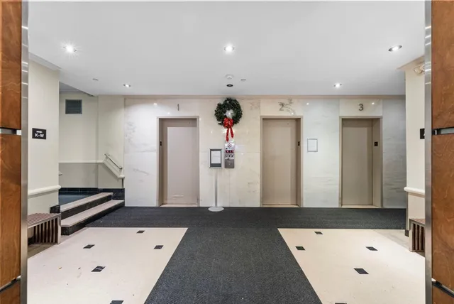 a kitchen with stainless steel appliances granite countertop a stove sink and cabinets