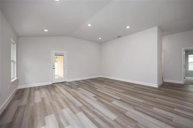 a view of empty room with white walls