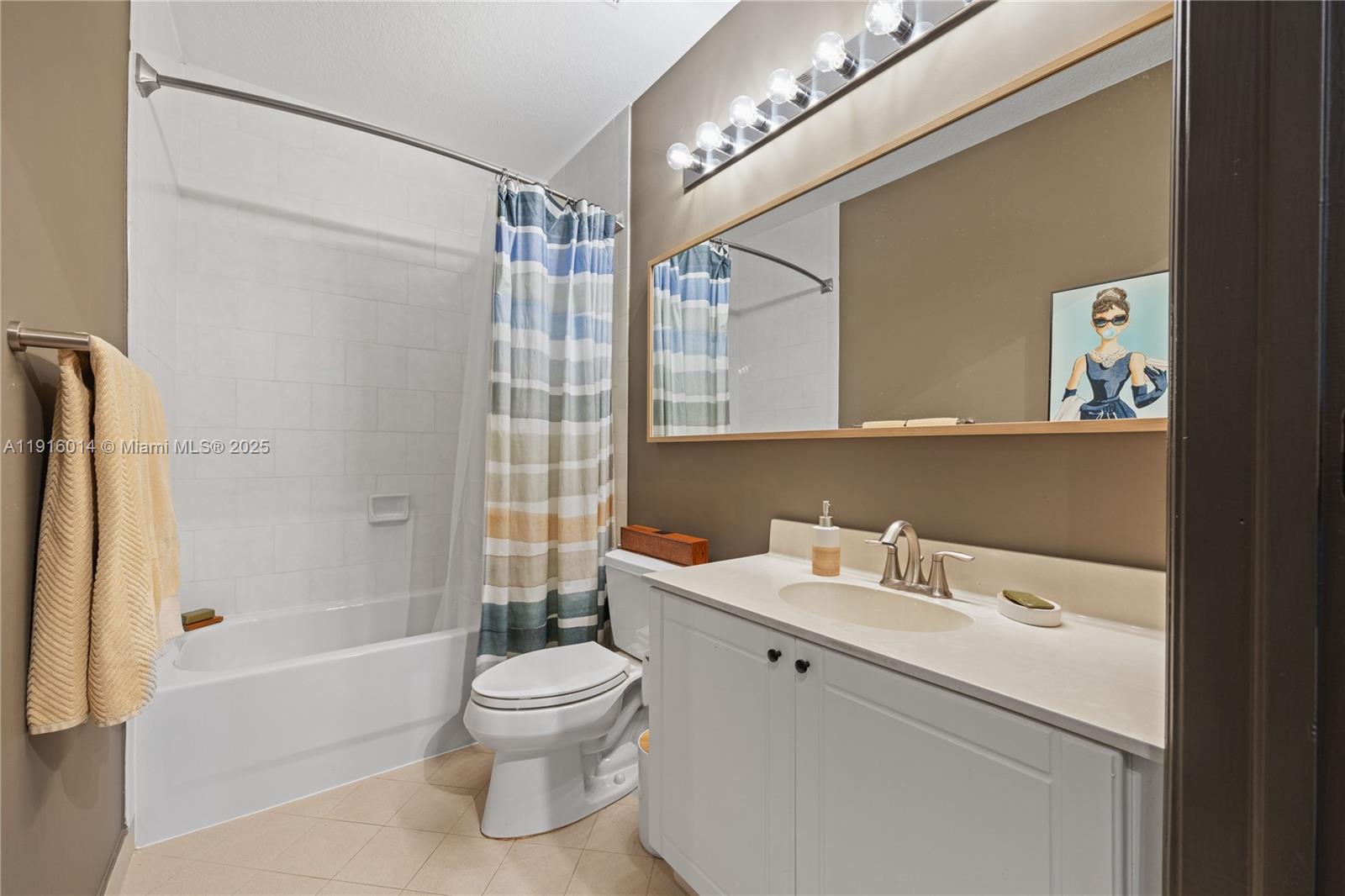 652 Northeast 63rd Street, Unit 403 Miami, FL 33138 - Photo 18 of 28 a bathroom with a sink a toilet and shower