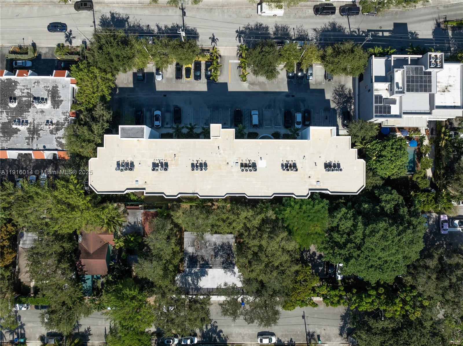 652 Northeast 63rd Street, Unit 403 Miami, FL 33138 - Photo 24 of 28 an aerial view of a house with a yard and large trees