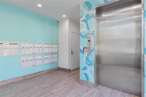 a view of an entryway with wooden floor