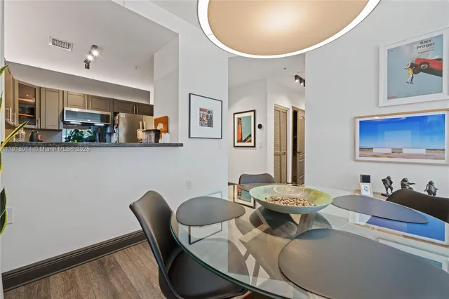 a living room with furniture and a mirror