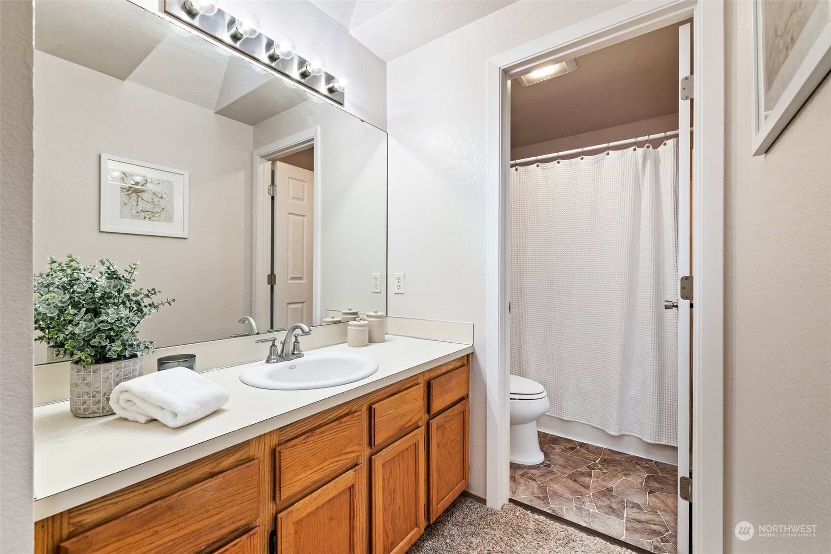 3017 166th Place Southeast Bothell, WA 98012 - Photo 14 of 28 a bathroom with a granite countertop sink and a mirror
