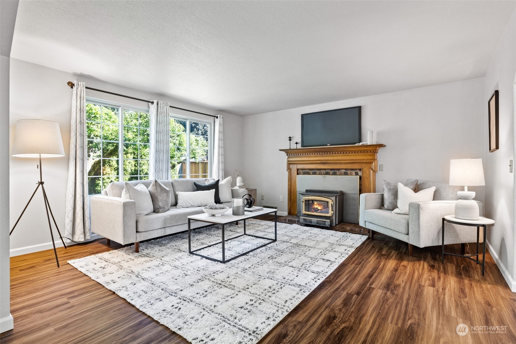 3017 166th Place Southeast Bothell, WA 98012 - Photo 5 of 28 a living room with furniture and a fireplace