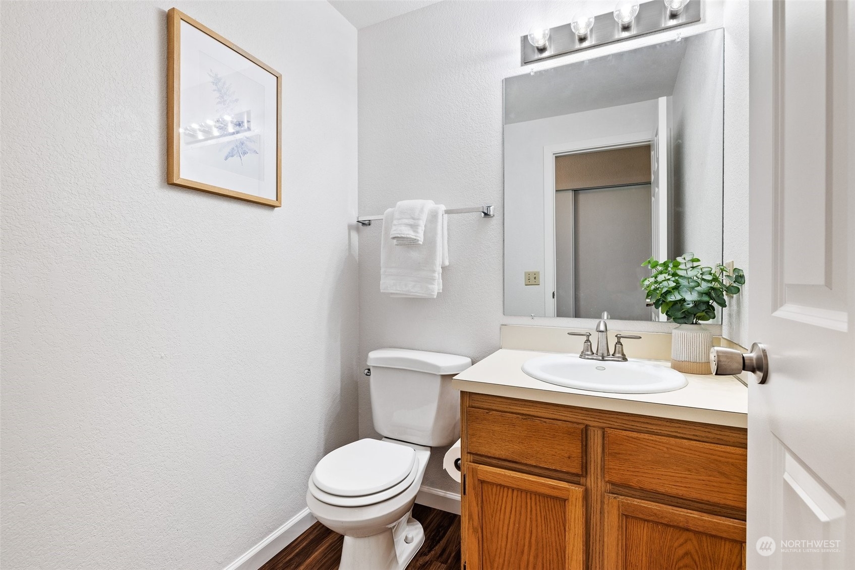 3017 166th Place Southeast Bothell, WA 98012 - Photo 10 of 28 a bathroom with a sink mirror and toilet