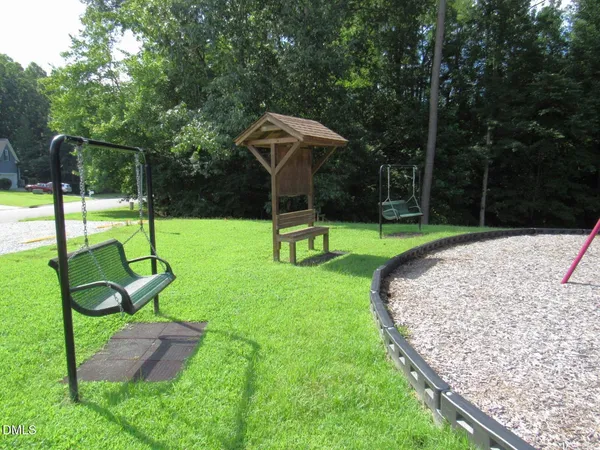 a wooden deck with a table and chairs