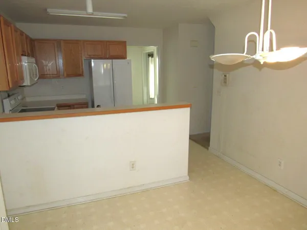 a view of a kitchen with granite countertop