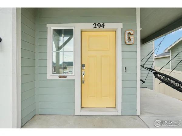 a view of a door and wooden floor