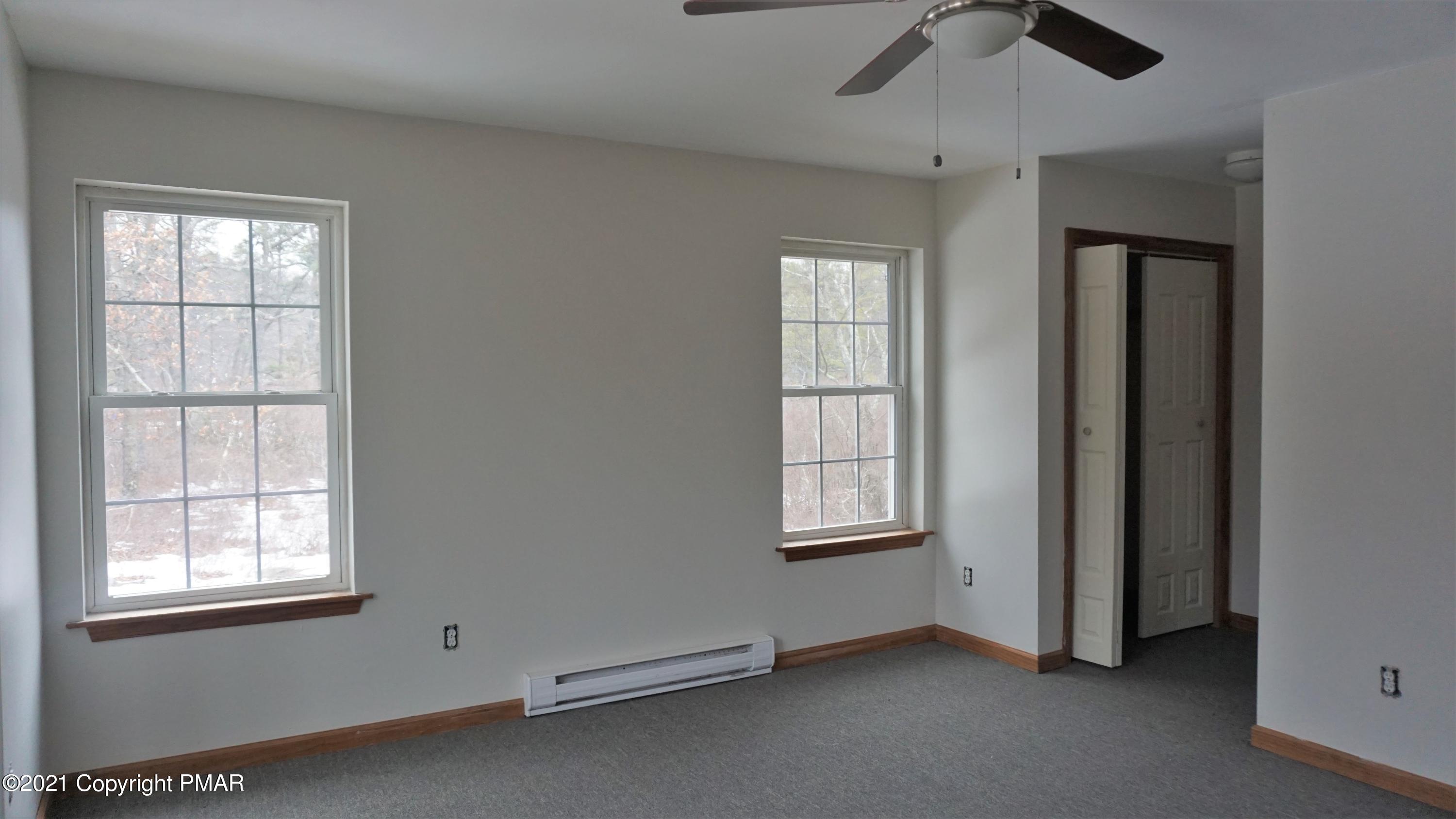 398 Gold Finch Road Bushkill, PA 18324 - Photo 12 of 24 an empty room with windows and closet