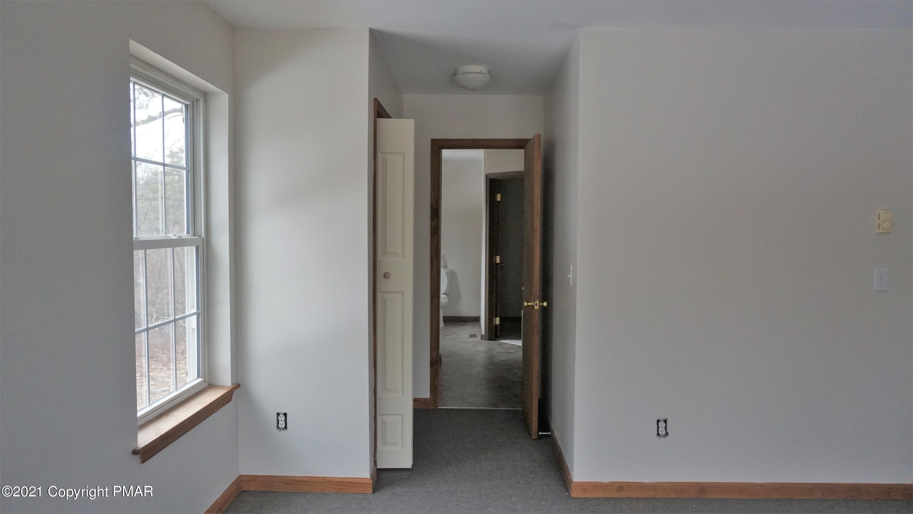 398 Gold Finch Road Bushkill, PA 18324 - Photo 13 of 24 an empty room with windows and closet